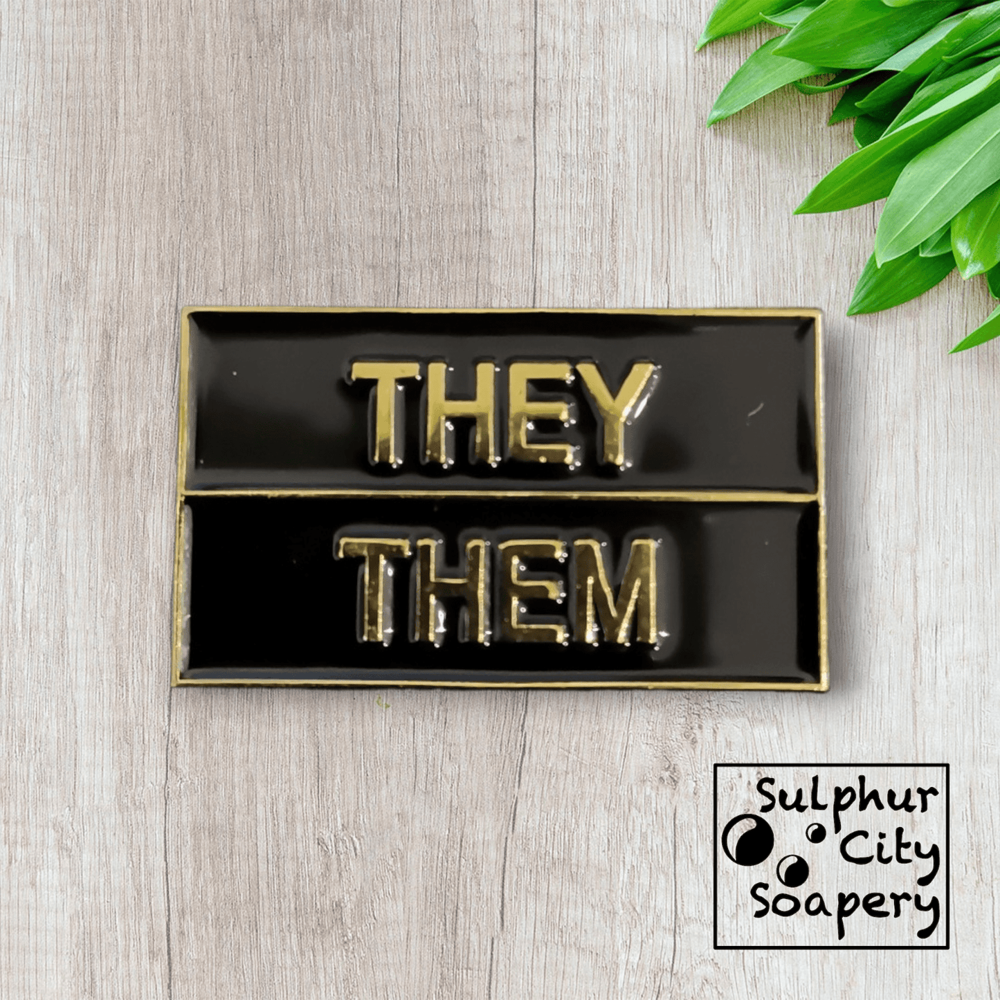 Sulphur City Soapery pronoun pin Pronoun pin in black and gold - They / Them