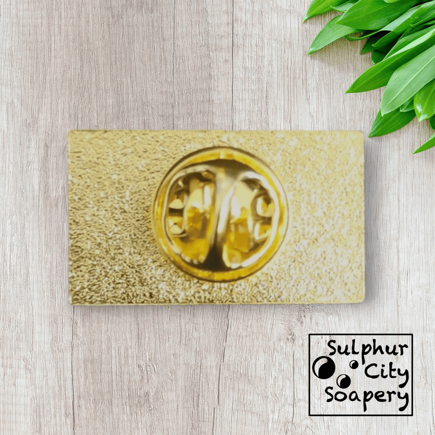 Sulphur City Soapery pronoun pin Pronoun pin in black and gold -  She / Her