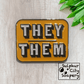 Sulphur City Soapery pronoun pin Pronoun pin in black and orange/yellow -  They / Them